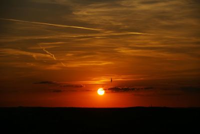 Scenic view of dramatic sky during sunset