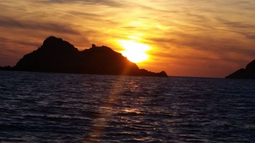 Scenic view of sea against sky during sunset