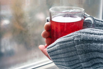 Close-up of hand holding drink