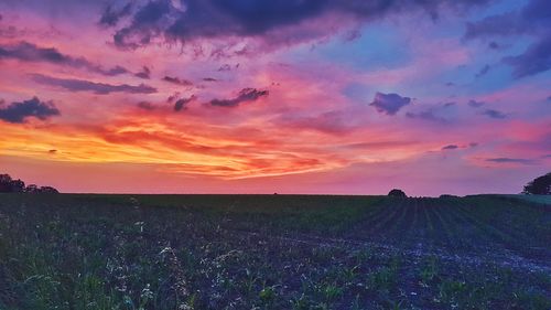 Scenic view of landscape against cloudy sky