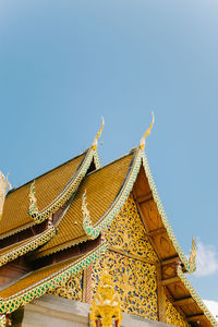 Low angle view of building against clear blue sky