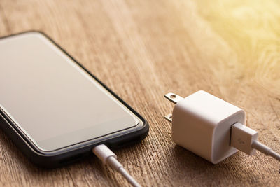 Close-up of mobile phone on table