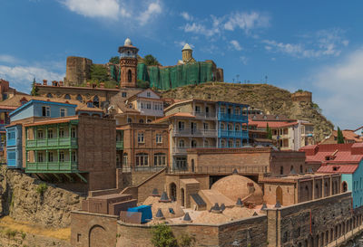 Buildings in city against sky