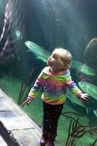 Full length of cute girl in water