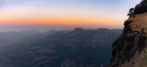 Scenic view of mountains against sky during sunset