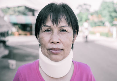 Portrait of woman wearing cervical neck collar