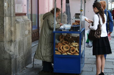 Woman standing at market stall