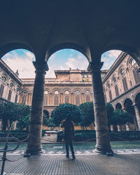 Woman walking in historical building