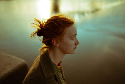 Portrait of young woman looking away
