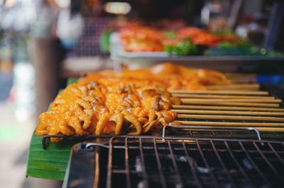 Close-up of meat on barbecue grill