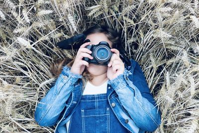 Portrait of woman photographing