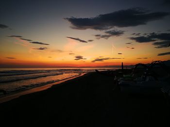 Scenic view of beach against sky during sunset