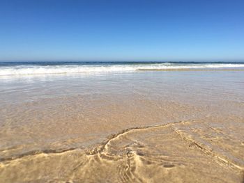 Scenic view of sea against clear sky