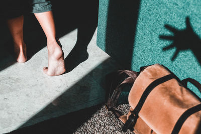 Low section of woman walking on floor