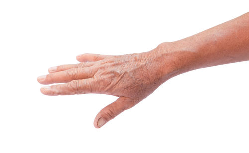 Close-up of hands over white background