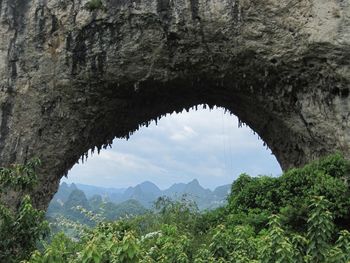 Scenic view of mountains seen through arch