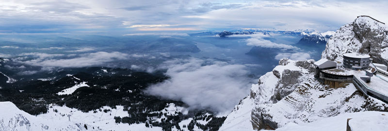 High angle view of snow covered mountain against sky
