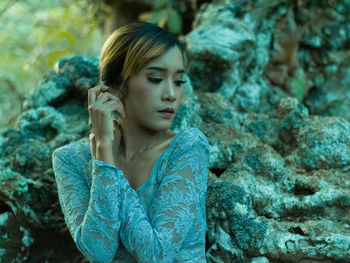 Close-up of young woman looking away