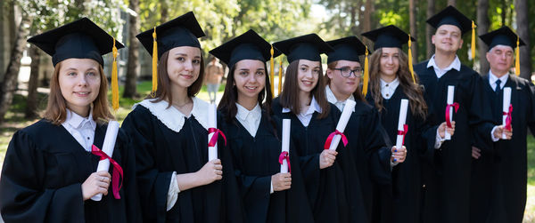 Portrait of students wearing graduation