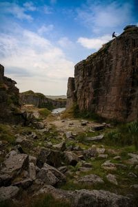 Rock formations on landscape against sky