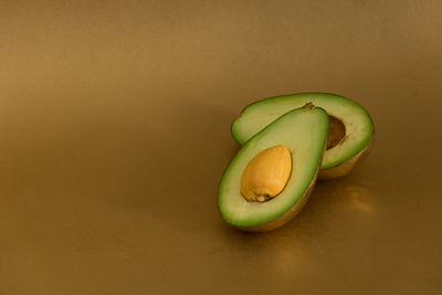 Close-up of green fruit on table