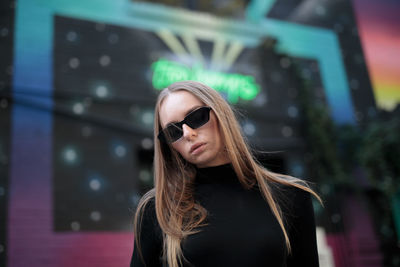 Portrait of young woman wearing sunglasses