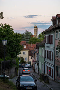 Houses in city against sky