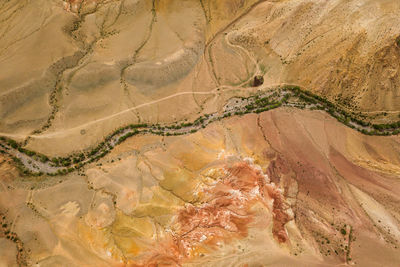 A stunning panorama of a mountain chain of peaks, a canyon with red clay, top view. mars 