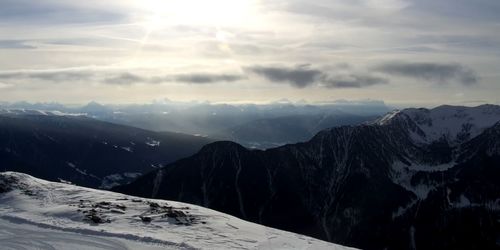 Scenic view of snowcapped mountains against sky