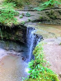 High angle view of waterfall in forest