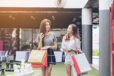 Woman standing at a store