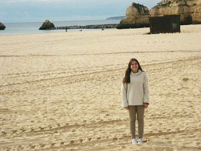 beach, sand, sea, shore, lifestyles, leisure activity, vacations, full length, water, casual clothing, young adult, horizon over water, person, standing, rear view, young women, sky