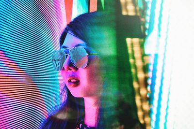 Close-up of young woman wearing sunglasses