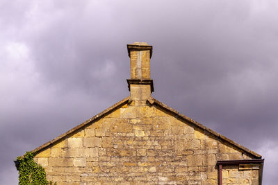 Low angle view of old building against sky