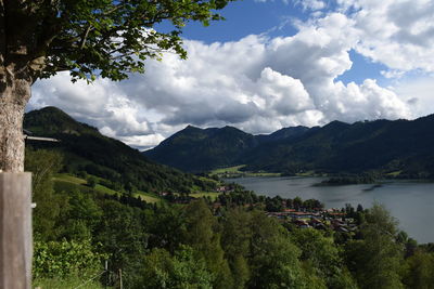 Scenic view of schliersee lake against cloudy sky