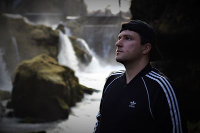 Portrait of young man looking away