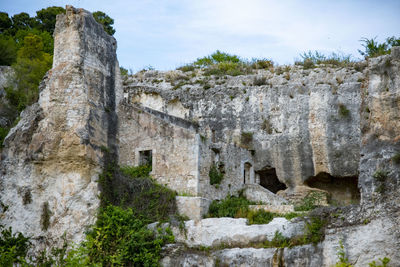 Low angle view of old ruins against sky