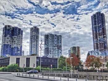 Modern buildings in city against sky