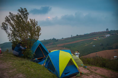 Tent on field against sky