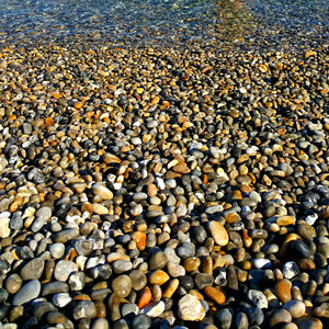 Full frame shot of pebbles at beach