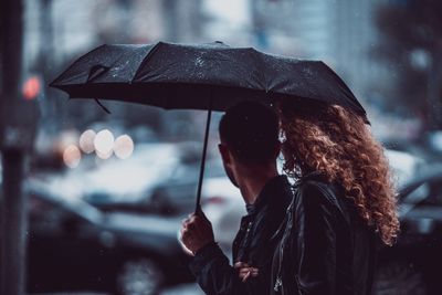 Side view of wet person in rainy season