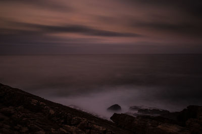 Scenic view of sea against sky at sunset