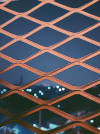 Full frame shot of chainlink fence against sky