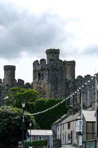 Low angle view of historical building against cloudy sky