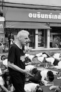 Full length of man sitting at market