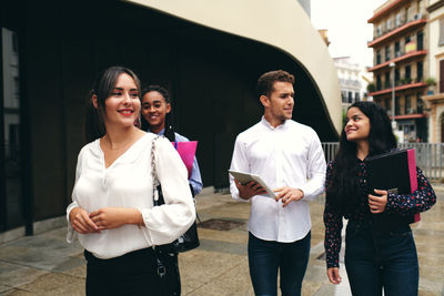 Young couple standing in city