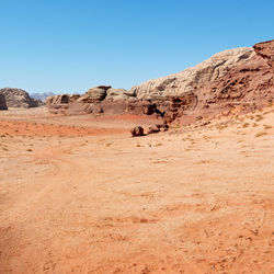 Scenic view of arid landscape against clear sky