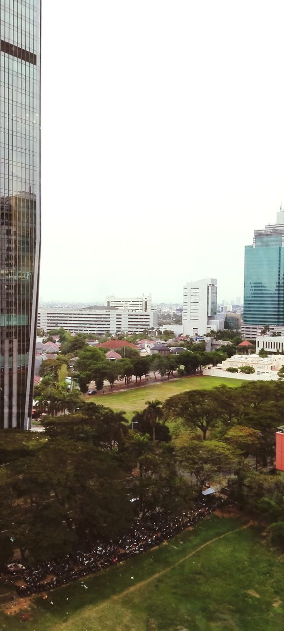 BUILDINGS AGAINST CLEAR SKY