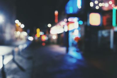 Defocused image of illuminated city at night