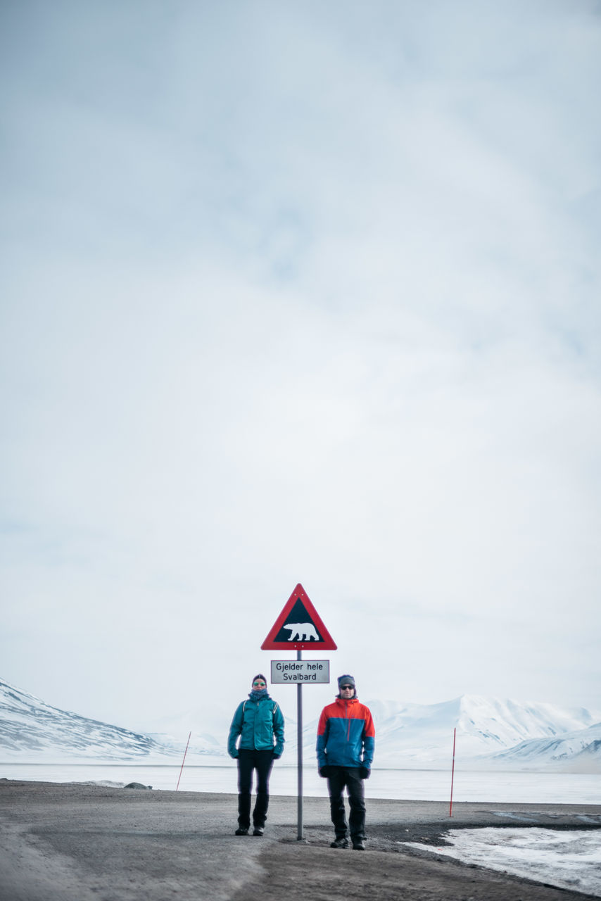 day, outdoors, sky, cloud - sky, real people, full length, men, two people, standing, nature, road sign, adult, people